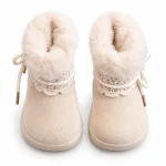 bottines bebe fille beiges fourrees a noeud sur fond blanc