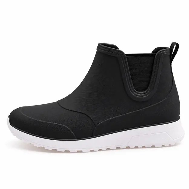 bottines de pluie femme noires et blanches fourrees vue de profil sur fond blanc 45178