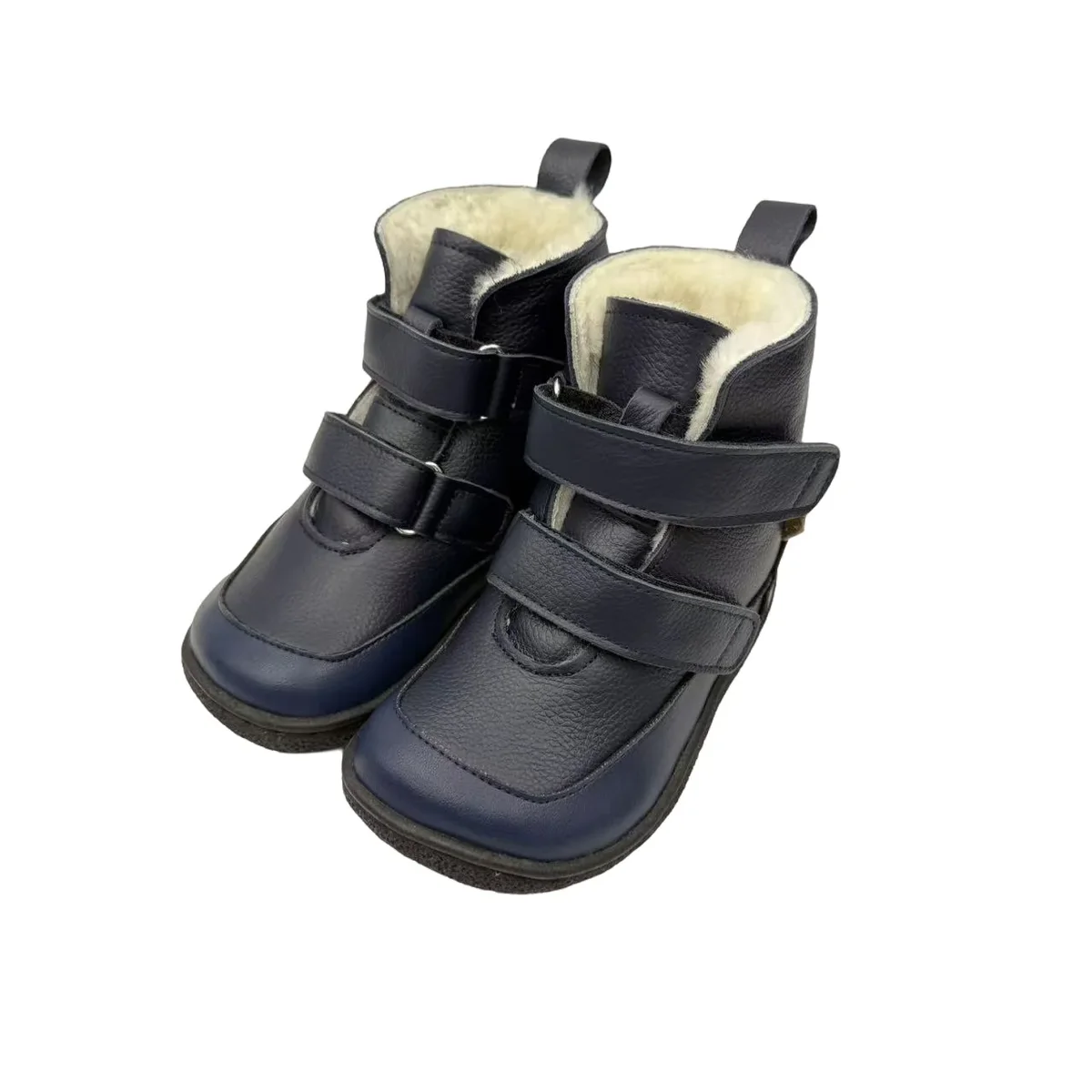 bottines enfant bleu marine fourrees a double scratch sur fond blanc