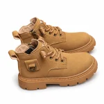 bottines garcon jaunes a lacets et anneau lateral sur fond blanc