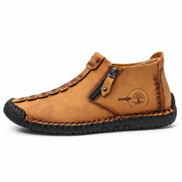bottines homme brun jaune fourrees a zip style mocassin vue de profil sur fond blanc 45344