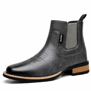 bottines homme grises sans lacets a surpiqures vue de trois quarts sur fond blanc 45313