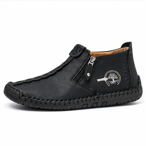 bottines homme noires fourrees a zip style mocassin vue de profil sur fond blanc 45345