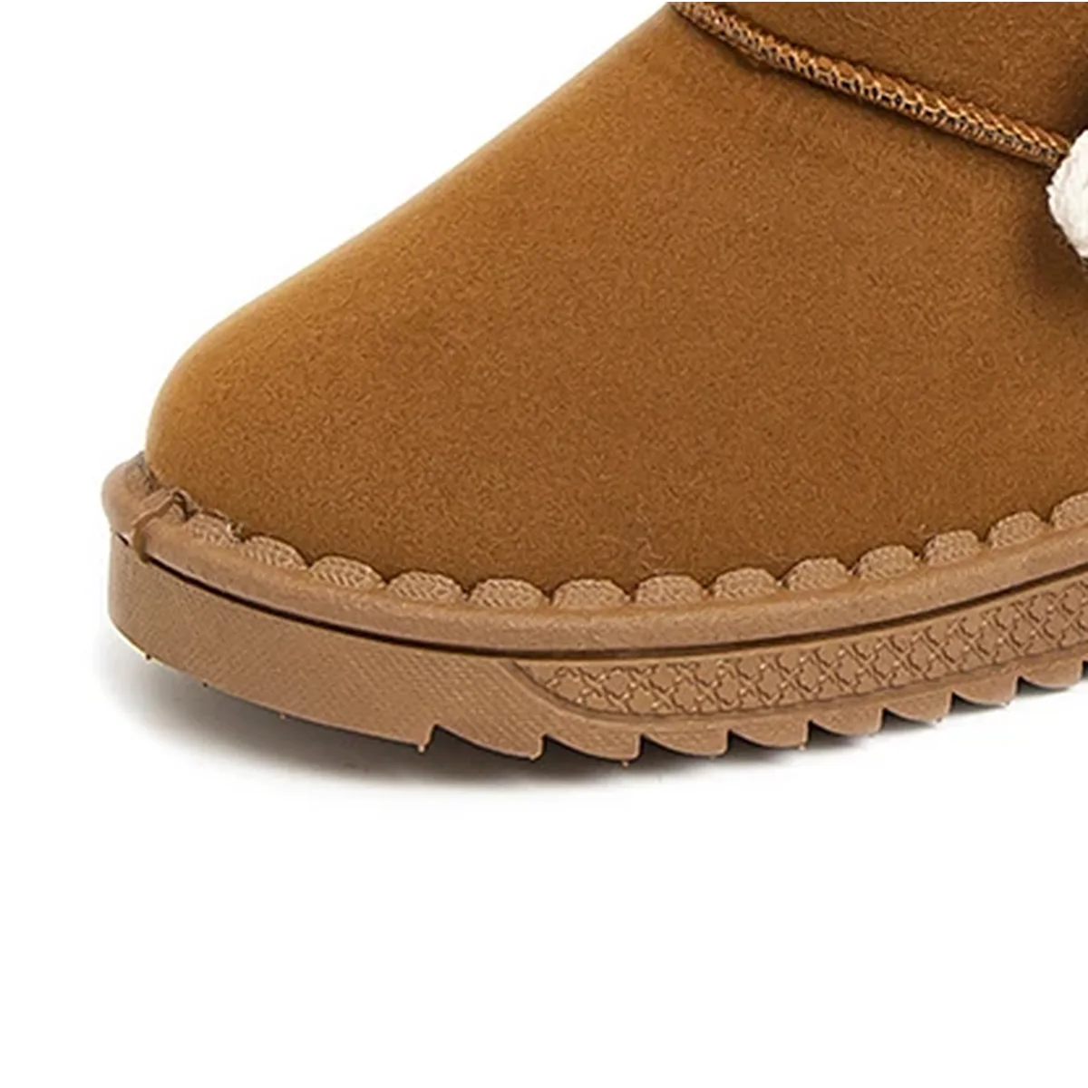 detail de la matiere et de la semelle des bottines fille marron fourrees a fleur