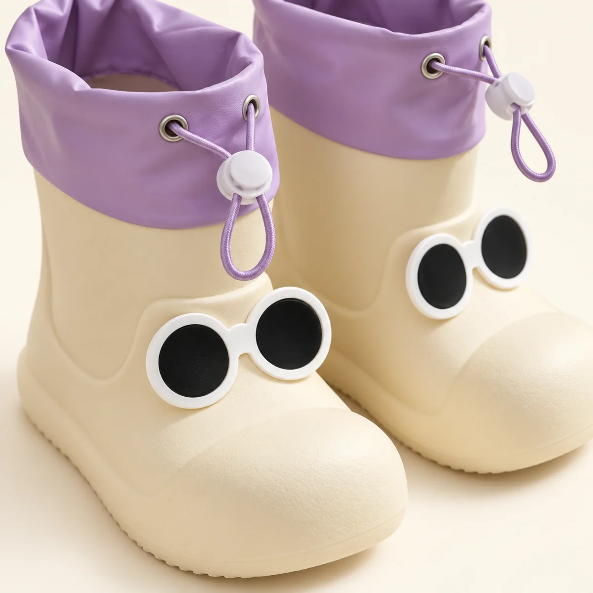 44357 14b bottes de pluie enfant blanches a yeux detail