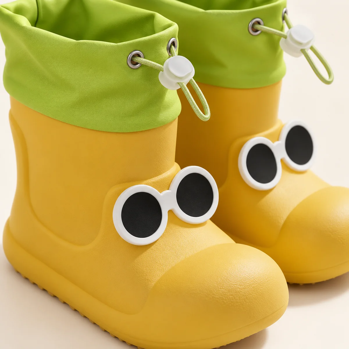 44358 14b bottes de pluie enfant jaunes a yeux e detail