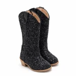 Bottes cowboy fille noires à finition pailletée avec lacets dans une boutique de mode pour enfants