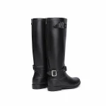 Bottes de pluie noires zippées à bride de cheville présentées sur fond blanc.