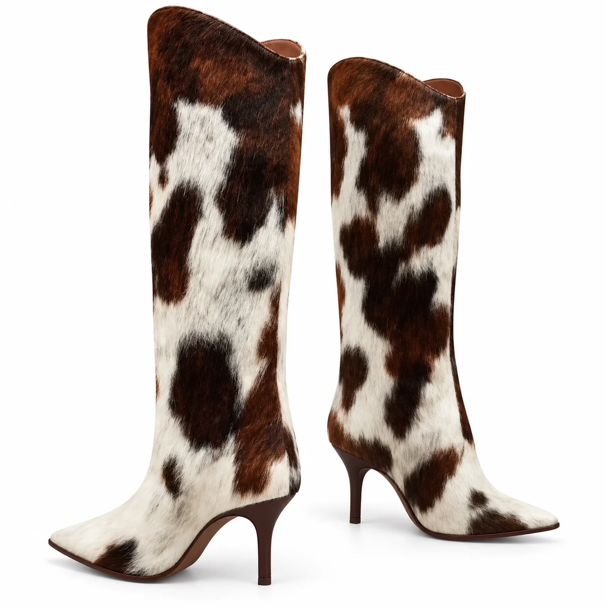 Bottes imprimé vache à talon aiguille vues de profil sur fond blanc.