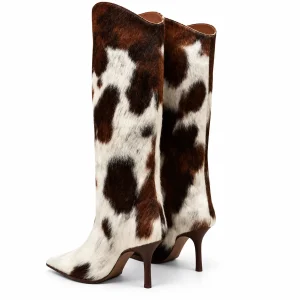 Bottes imprimé vache à talon aiguille présentées sur fond blanc.