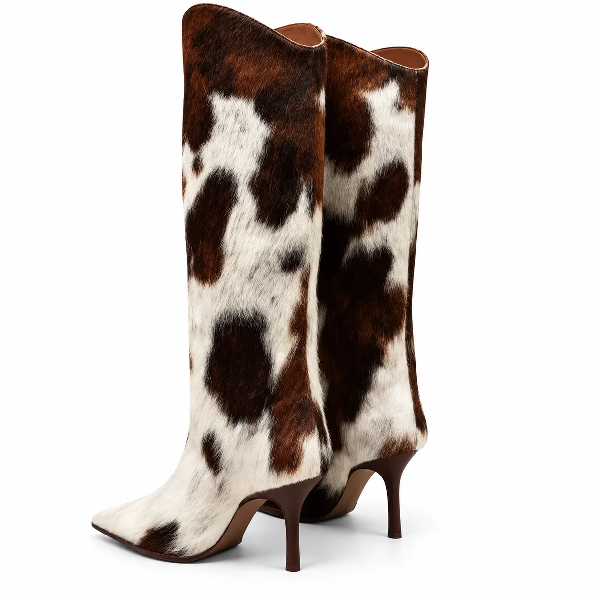 Bottes imprimé vache à talon aiguille présentées sur fond blanc.
