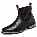 Bottines Chelsea homme noires avec motif reptile et talon élégant