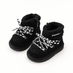 Bottines enfant noires fourrées avec lacets contrastants pour l'hiver