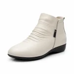 bottines femme beiges fourrees et compensees vue de trois quarts sur fond blanc 45071