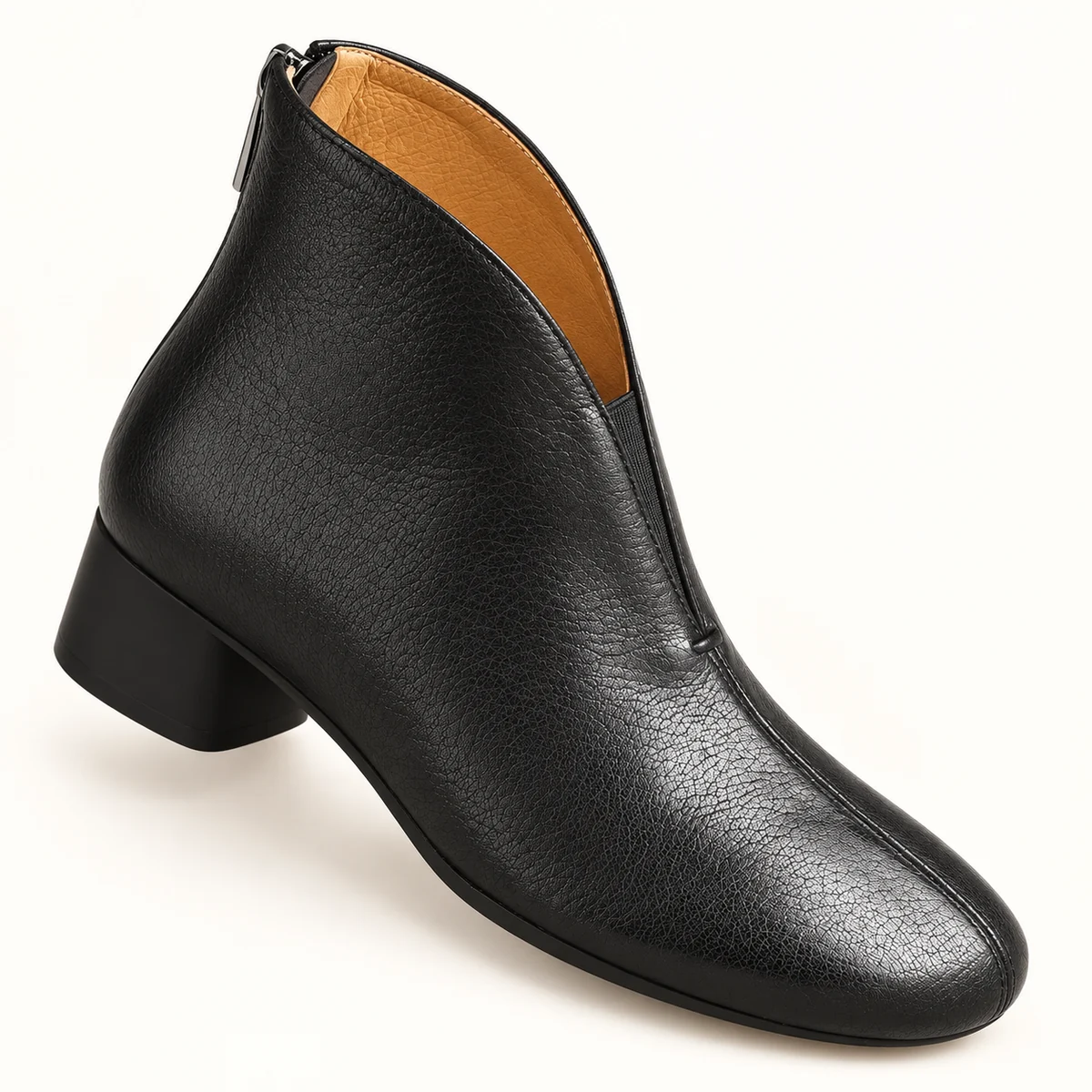 Détail des bottines en cuir noir confortables avec fermeture à zip arrière