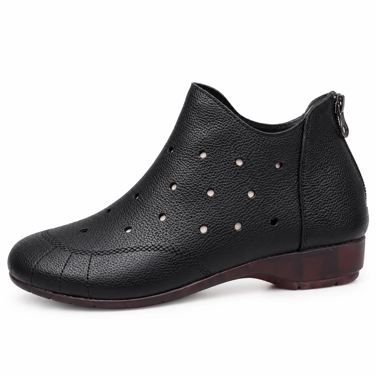 Vue de face des bottines noires à zip et design ajouré pour femme