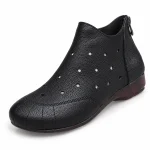 Bottines noires à fermeture zip pour femme avec silhouette élégante