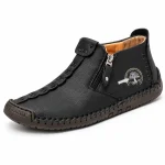 Bottines homme noires à zip et coutures apparentes en cuir élégantes