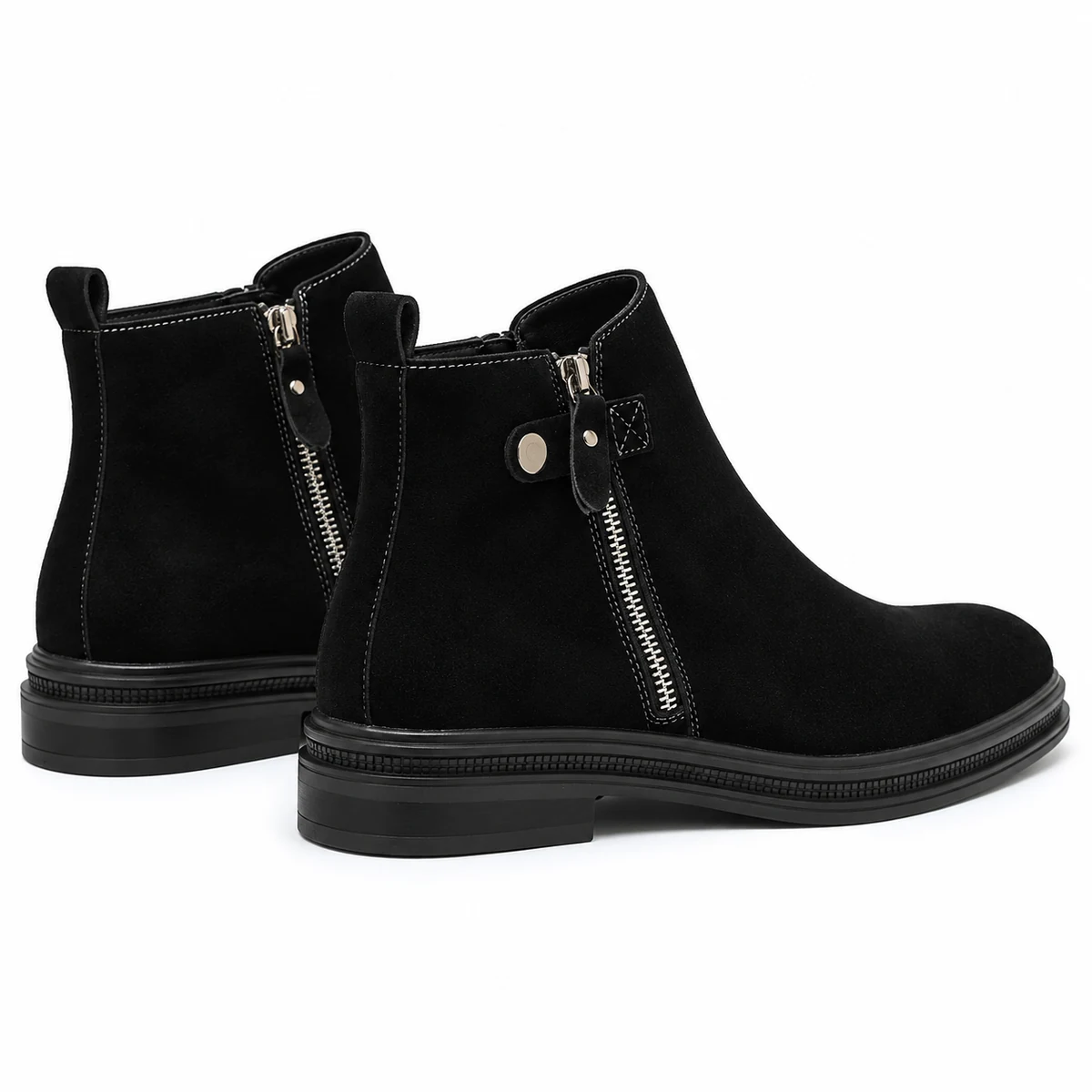 Vue latérale de bottines homme noires à zip et talon discret